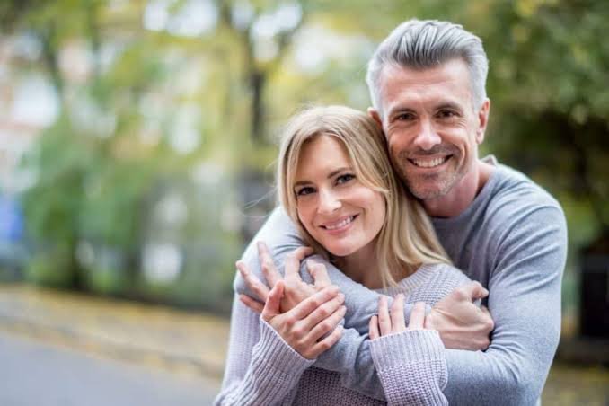 Smiling couple outdoors enjoying an active lifestyle